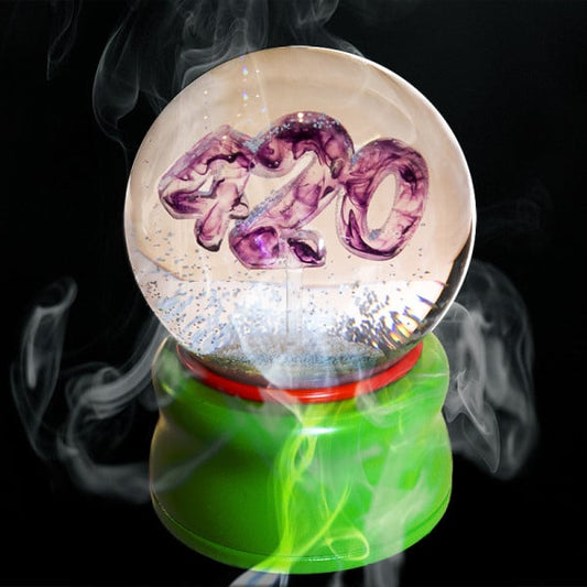 Ligorano Reese's Smoke Gets In Your Eyes 420 deluxe glass snow globe. Signed and numbered limited edition of 25. Smoky purple haze resin cast. Kush Green base with secret stash compartment. From Pure Products USA.